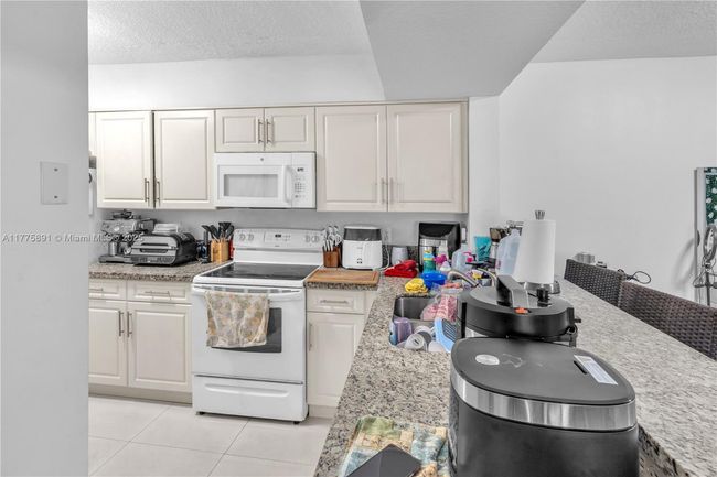 APT-104 - 18810 Nw 57 Th Ave, Condo with 2 bedrooms, 2 bathrooms and null parking in Hialeah FL | Image 12