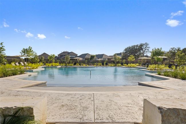 Community pool with a residential view | Image 29