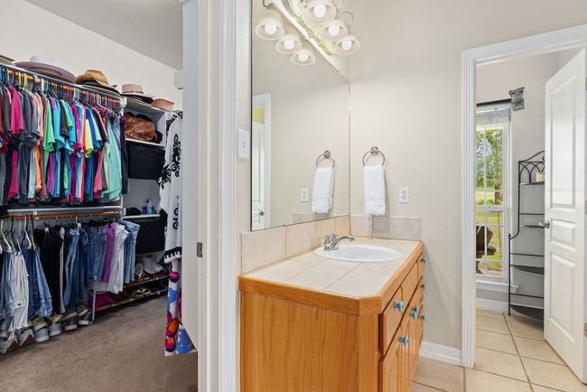 Dual vanities, water closet, and very organized main closet. | Image 17