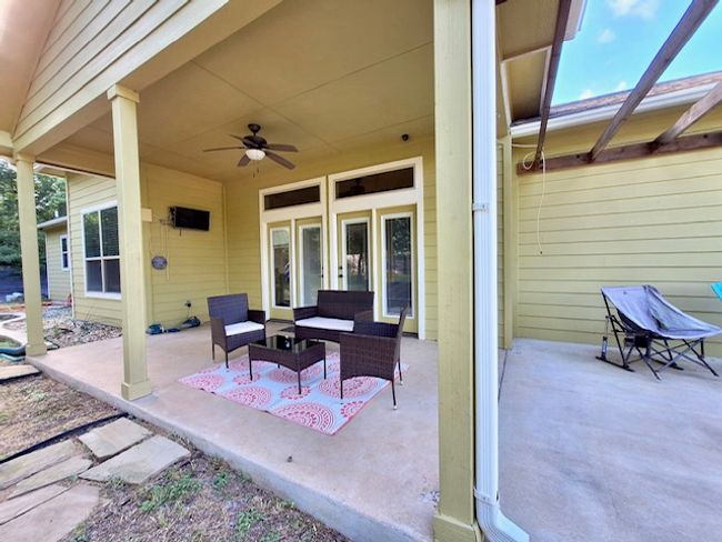 View of patio / terrace featuring a ceiling fan and an outdoor living space | Image 19