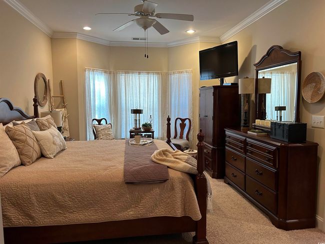 Bedroom with ornamental molding, recessed lighting, and light colored carpet | Image 9