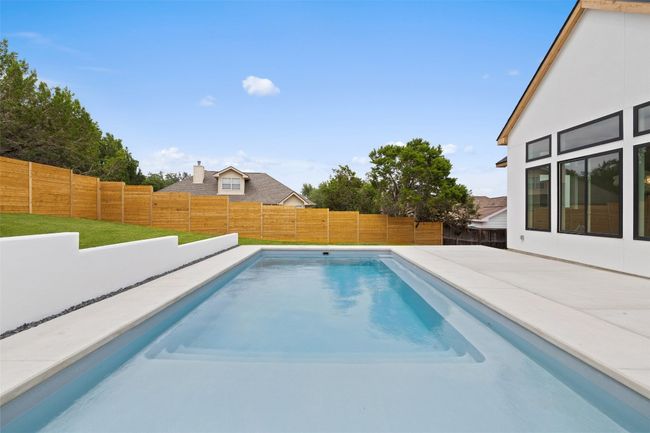 View of swimming pool featuring a patio | Image 24