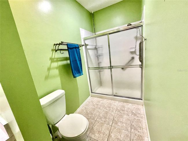 The toilet and walk-in shower are in a separate area | Image 37