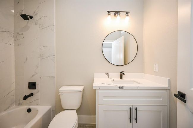With The Bedroom Comes A Full Bathroom That Has The Combined Stand-Up Shower & Bathtub | Image 12