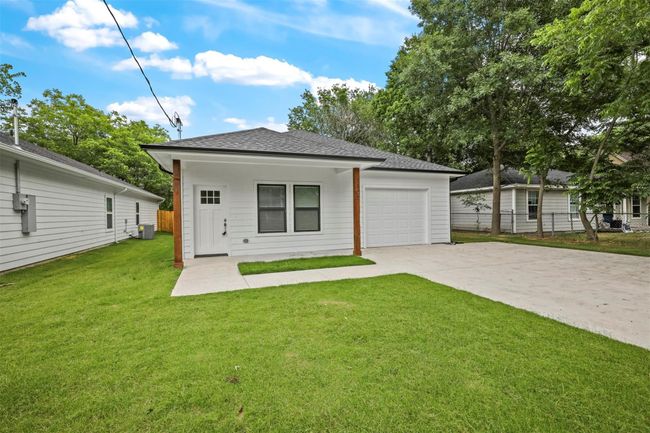 View of front of property featuring driveway, a garage, and a shingled roof | Image 15
