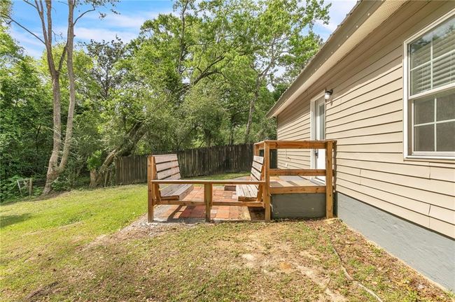 Wooden deck with fence and a lawn | Image 42