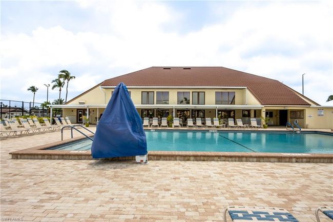 View of swimming pool featuring a patio area | Image 17