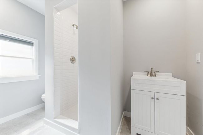 Secondary full bathroom with walk-in shower. | Image 9