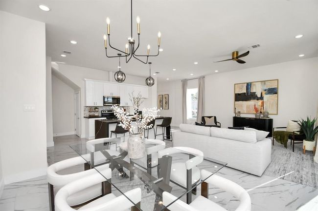 The home has upgraded light fixtures throughout. | Image 12