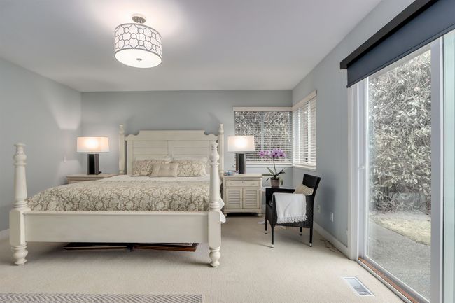 Bedroom with carpet flooring and access to outside | Image 15