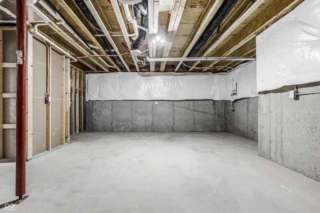 There is a huge unfinished area of the basement that the owners used as a home gym, but is also great for storage. | Image 61