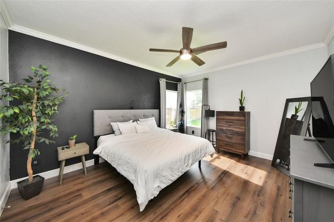 Spacious main bedroom conveniently located on the first floor. | Image 15