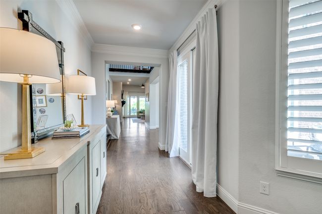 Guests are greeted with sliding doors to a cozy courtyard and plantation shutters. | Image 4