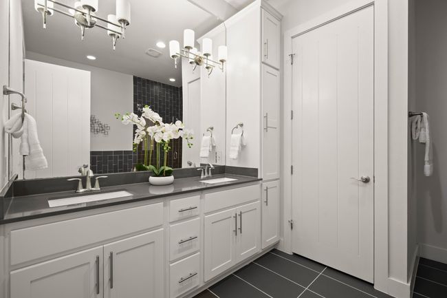 Bathroom featuring double vanity, recessed lighting, tile patterned floors, and decorative backsplash | Image 17