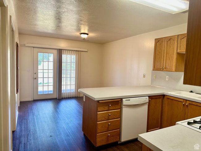 The spacious kitchen flows into the dining area, offering plenty of space for both everyday moving and entertaining. | Image 9