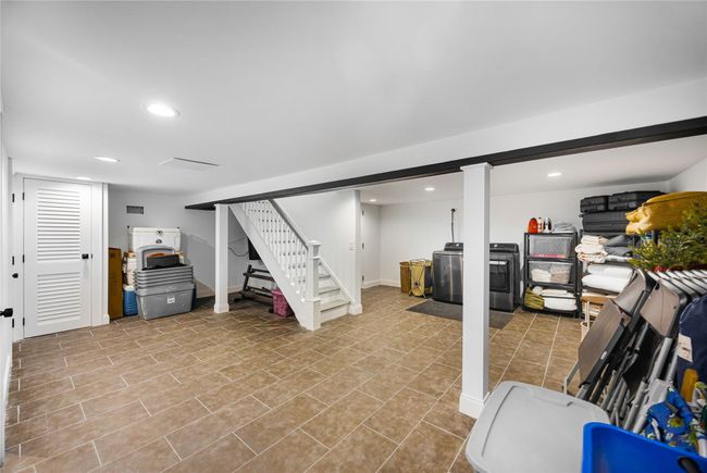 Finished basement featuring baseboards, recessed lighting, washer / clothes dryer, and stairway | Image 42
