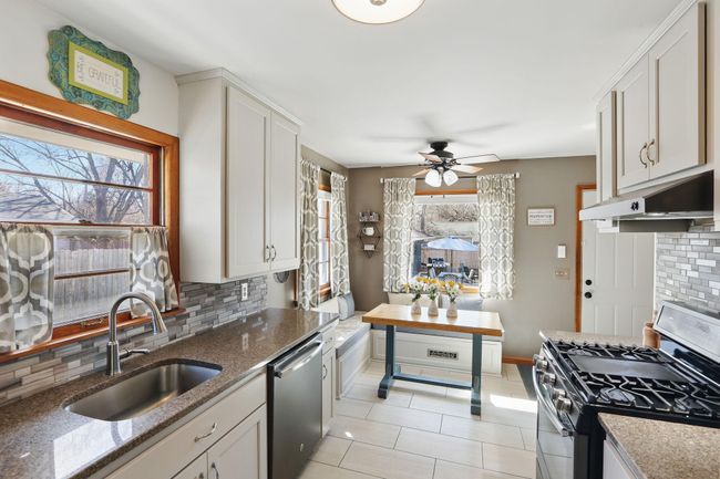 Remodeled kitchen with new cabinets, quartz countertops and tile flooring in 2024 | Image 7