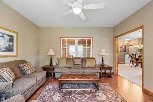 Den with double french doors to the great room allows for separate space to read or watch television. | Image 10