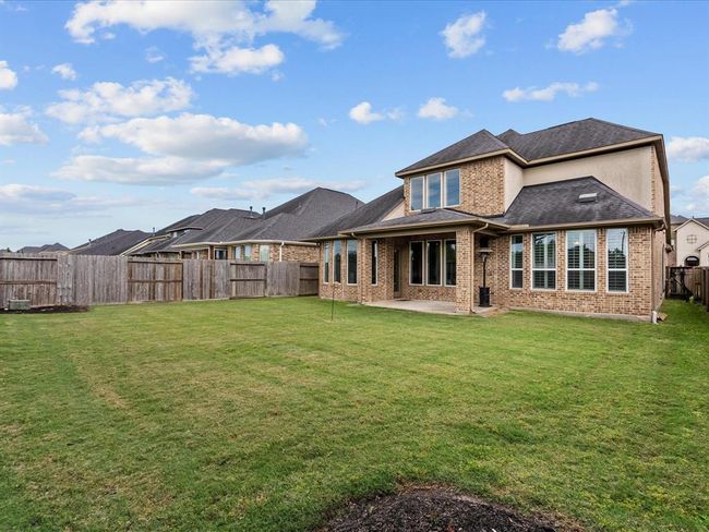 Nice size back yard with a covered patio and no back neighbors | Image 38