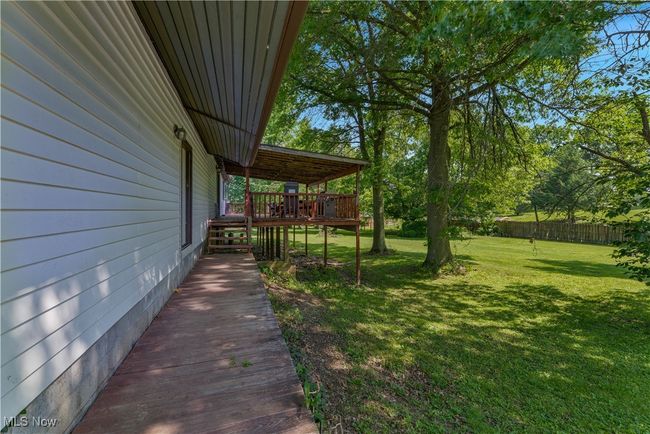 View of yard with a deck | Image 39