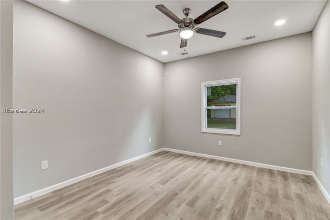 Unfurnished room with light hardwood / wood-style flooring and ceiling fan | Image 24