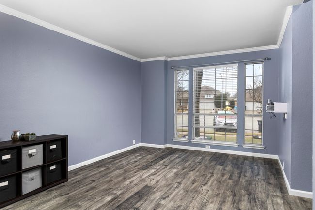 Spare room featuring ornamental molding and dark hardwood / wood-style floors | Image 7