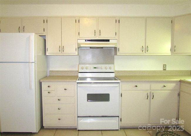 Kitchen showing applicances & countertops | Image 12