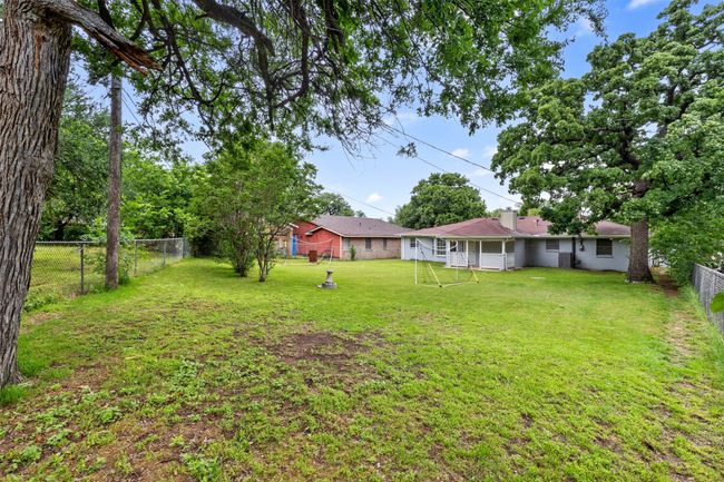 View of yard with a fenced backyard | Image 26