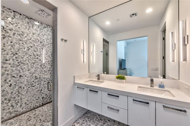 Full bathroom featuring visible vents, a sink, and a shower stall | Image 8