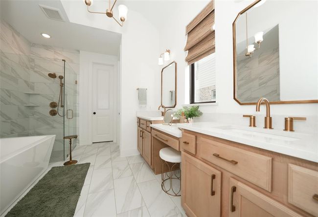 Enjoy the luxury of a spacious bath with a separate tub and shower. | Image 23