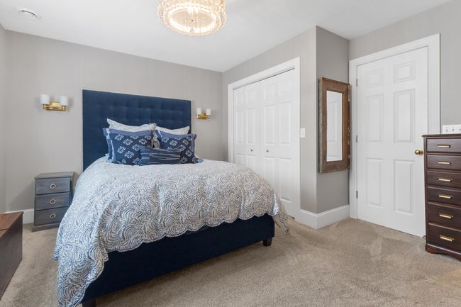 Spacious closet and entrance to an updated full bathroom. | Image 20