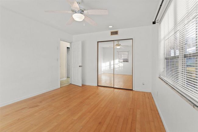 Bedroom 1 with wood floors | Image 15