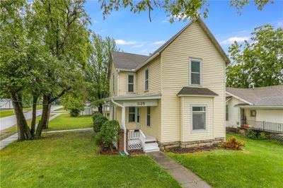 View of front property featuring covered porch and a front lawn | Image 2