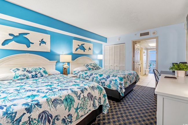 Carpeted bedroom featuring tile patterned floors | Image 5