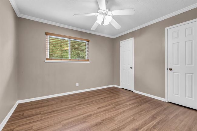 Third bedroom (without staging) features a large closet and ceiling fan. | Image 31