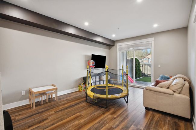 Living area featuring recessed lighting, dark wood-style floors, and baseboards | Image 29