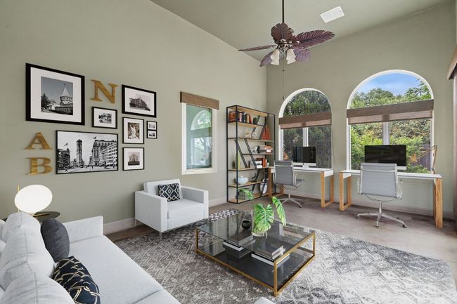 Tiled living room with baseboards, a ceiling fan, visible vents, and a towering ceiling | Image 21