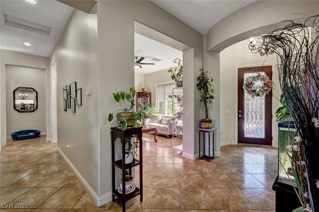 Entrance foyer with ceiling fan and baseboards | Image 13