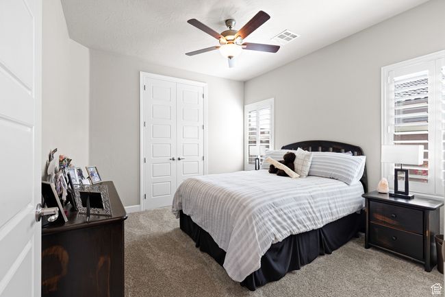 Bedroom with carpet, a closet, and a ceiling fan | Image 28