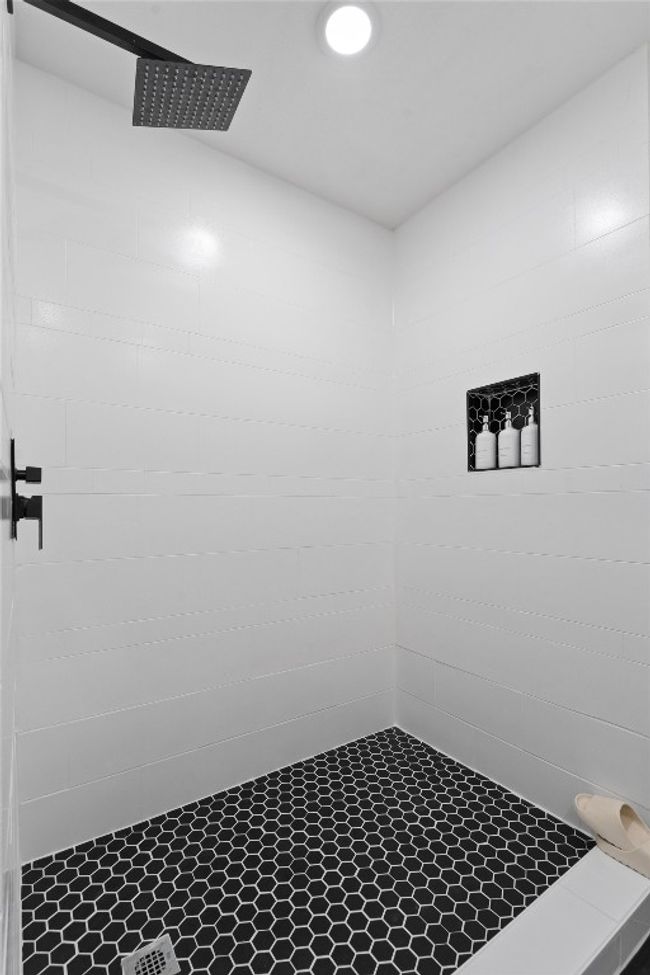 Bathroom featuring tiled shower | Image 17