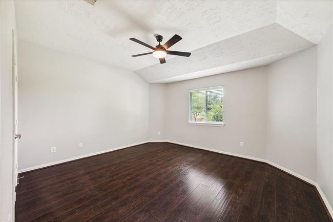 Second generously sized bedroom with new fan (2/24), beautiful engineered wood flooring, nice sized closet and window blinds. | Image 42