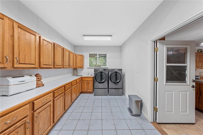 Mud room/canning area/laundry room. | Image 13