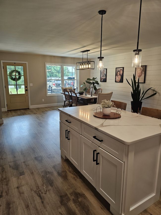 Front area currently being used as formal dining. Can also be used as a living area. Very flexible space. Can meet everyone's needs. | Image 13