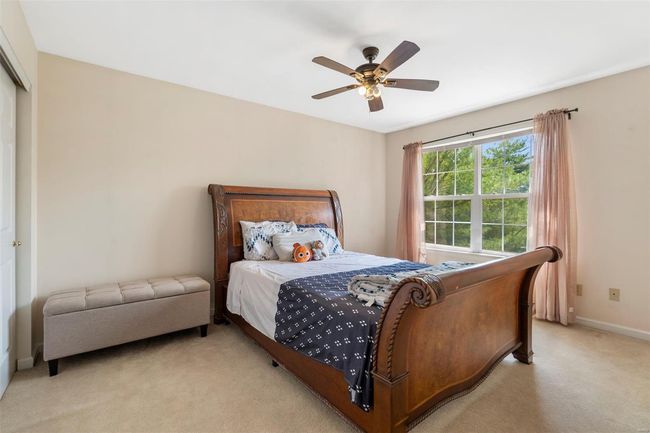 Carpeted living room with visible vents and baseboards | Image 12