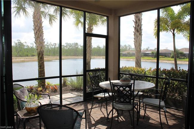 Sunroom with a water view and a healthy amount of sunlight | Image 26