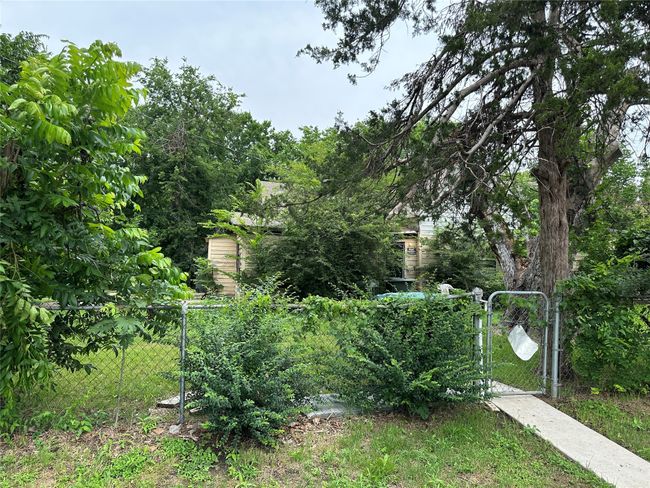View of yard with a gate | Image 6