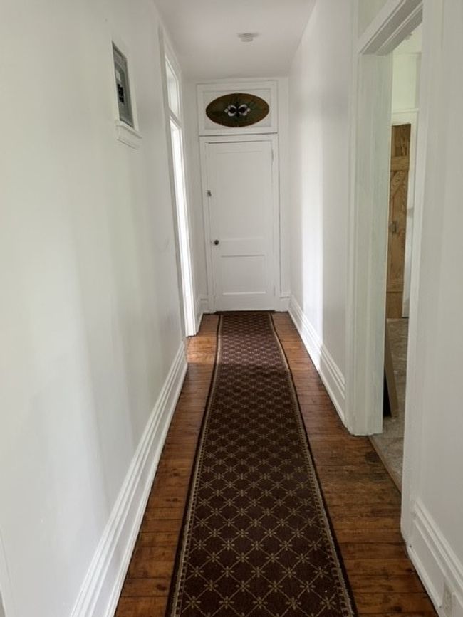 Hallway with wood flooring | Image 5