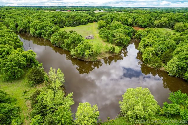 Aerial view of a nearby body of water and a forest | Image 57