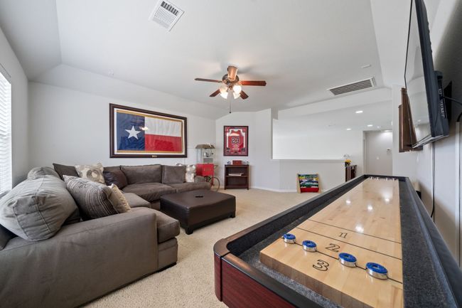 Recreation room featuring ceiling fan and carpet | Image 17