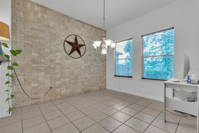 Informal dining area, just beyond the bar seating | Image 8